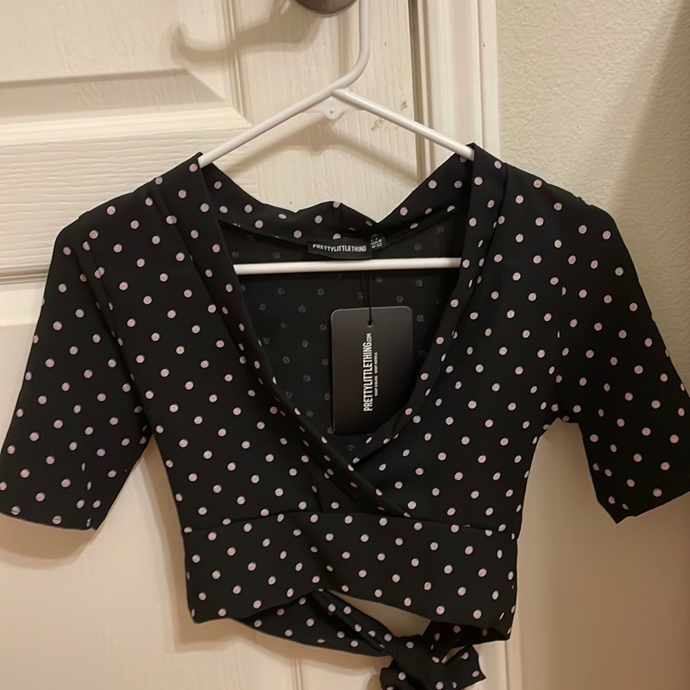 PrettyLittleThing Black polka dot printed crepe wrap crop blouse